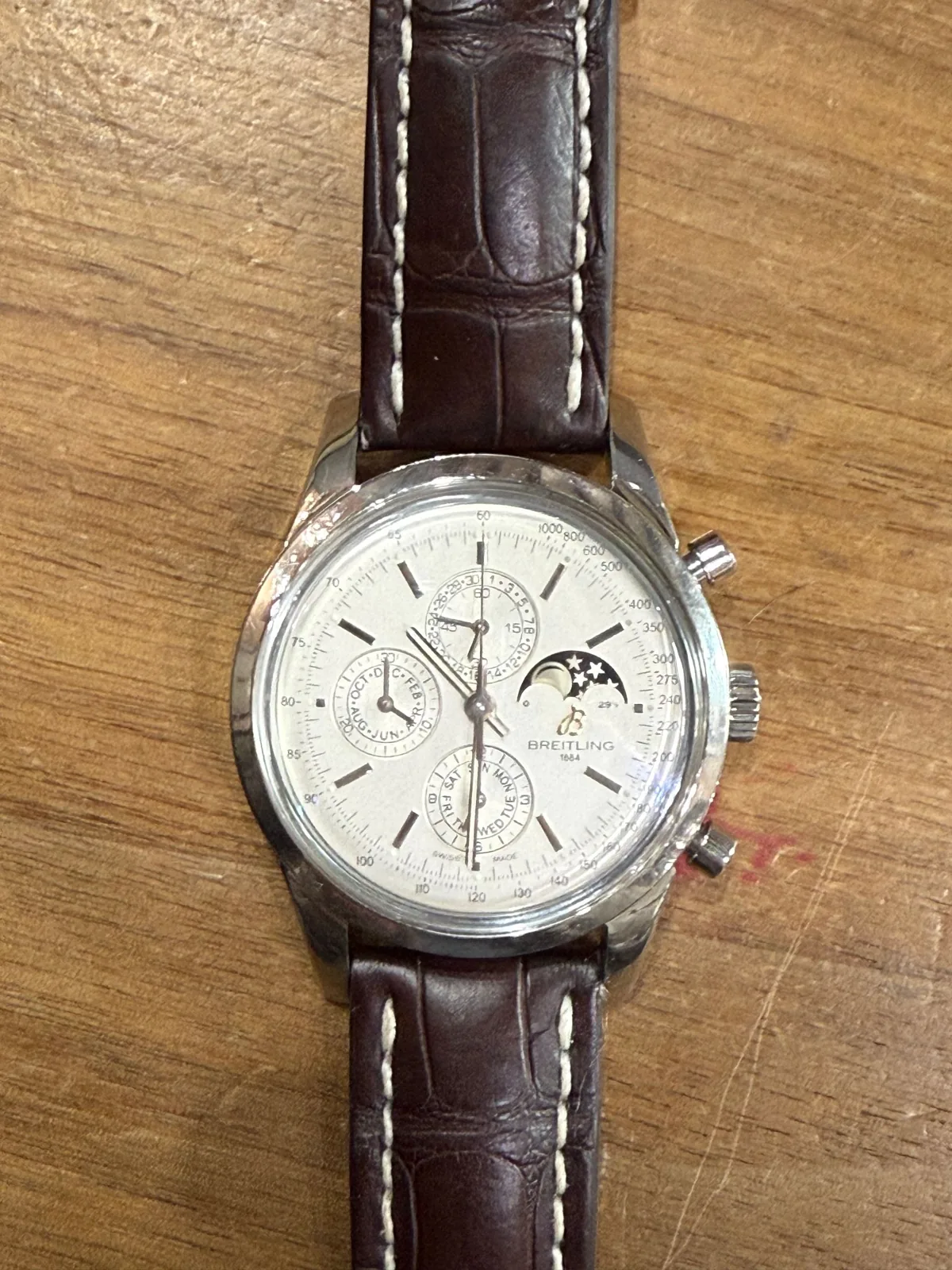A moonphase chronograph on a brown leather strap
