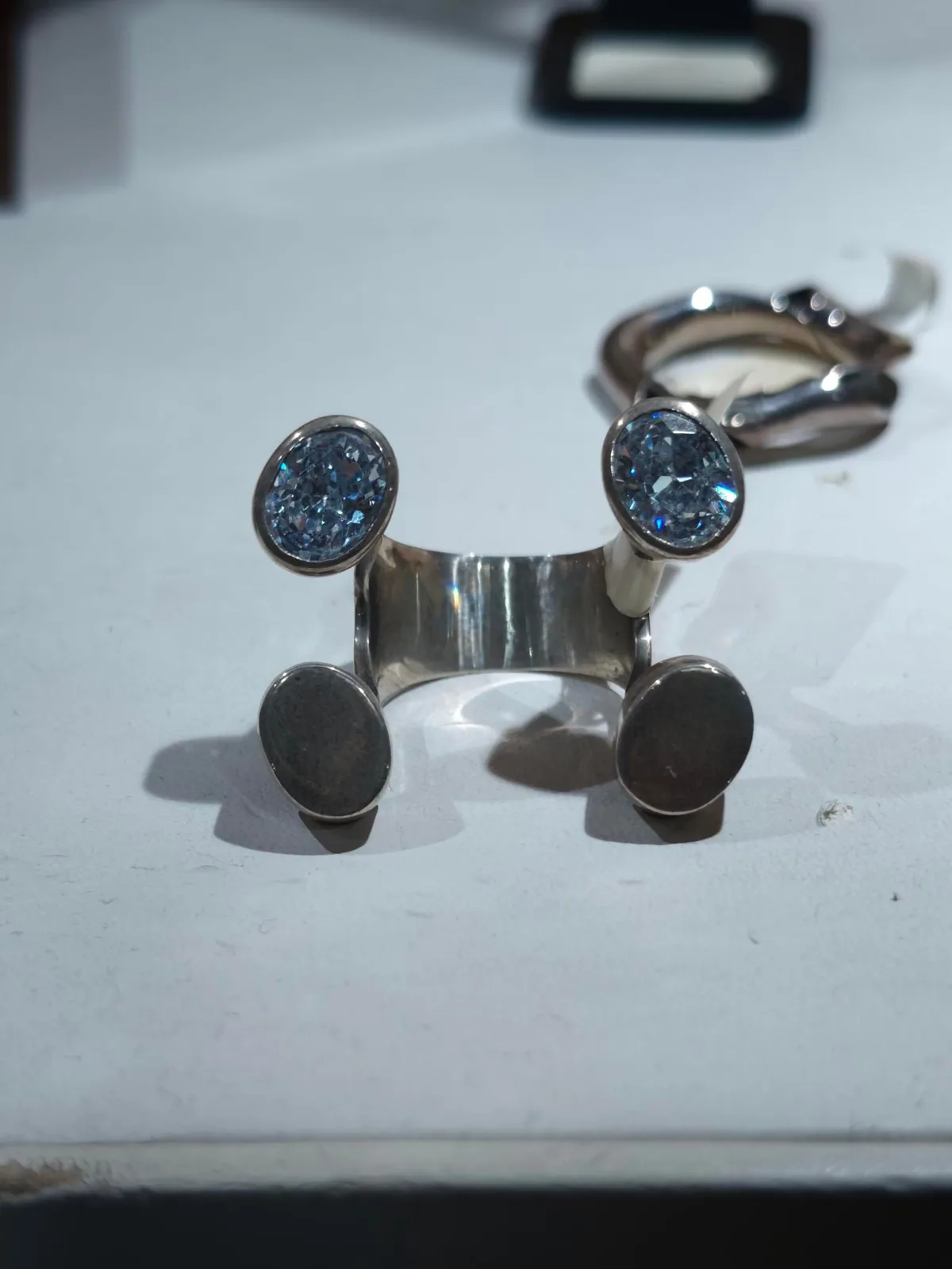 A ring with two pave-set domes on a wide band