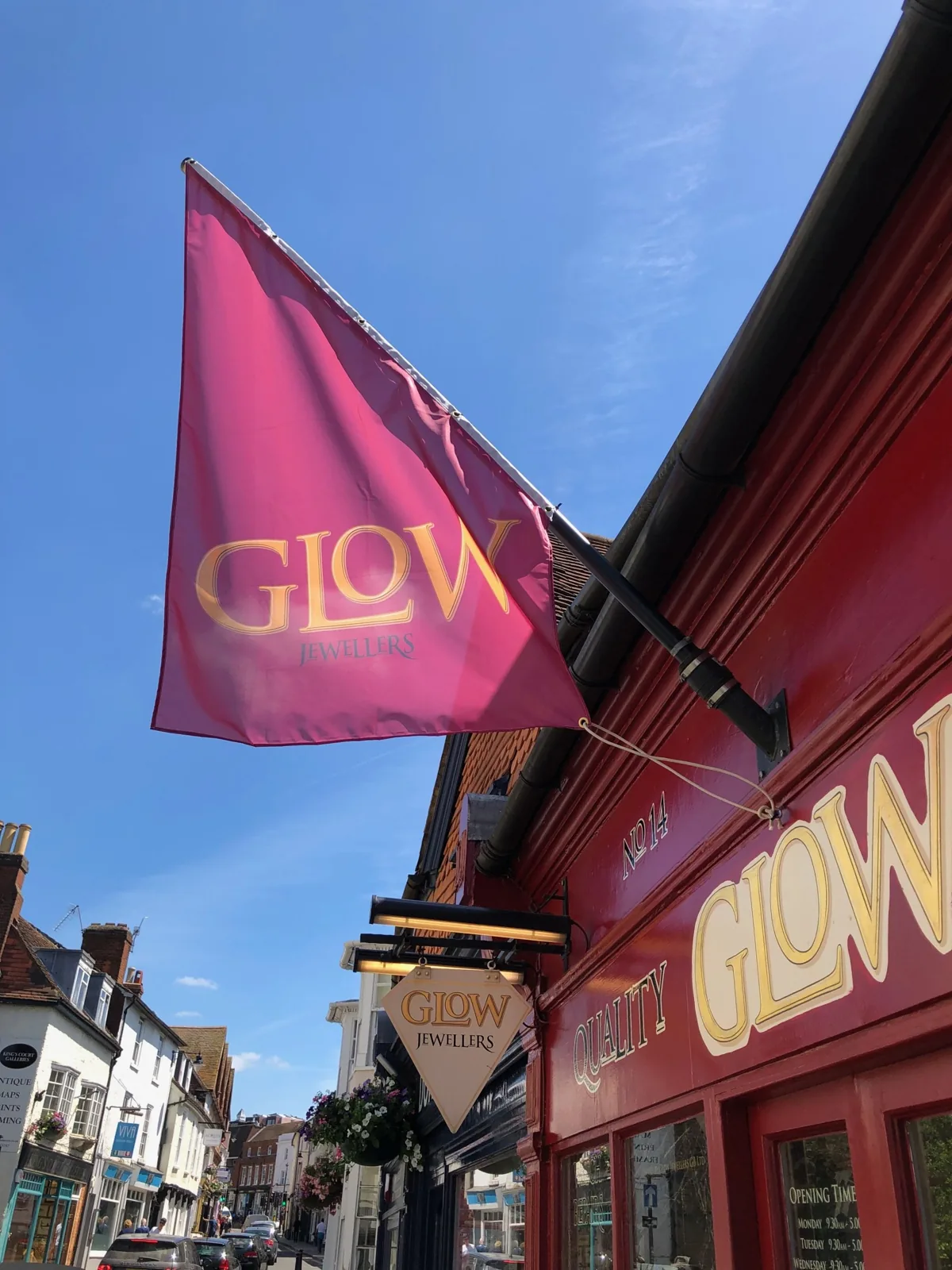 The red Glow Jewellers shopfront with its flag, West Street, Dorking